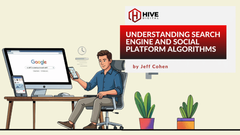 Man sitting at desk in front of computer with mobile device in hand