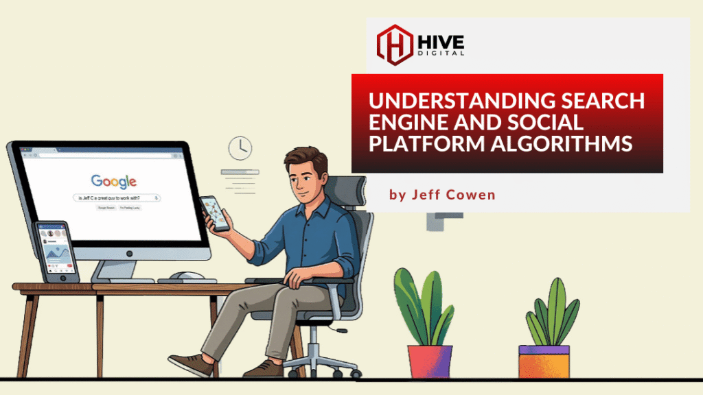 Man sitting at desk in front of computer with mobile device in hand