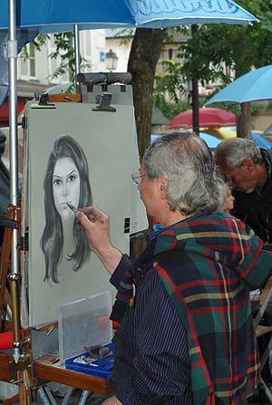 English: Street artist at La Place du Tertre, ... English: Street artist at La Place du Tertre, ...